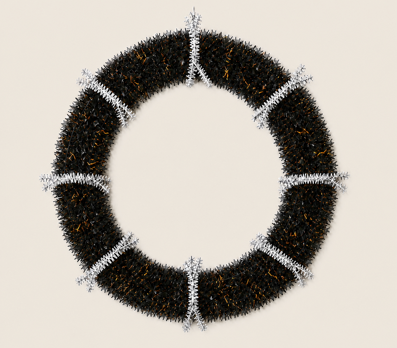 Black and orange Halloween garland wrapped around a wire wreath frame with silver pipe cleaners ready for decorating.